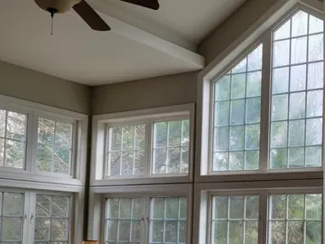 Fogged great-room window glass before replacement.