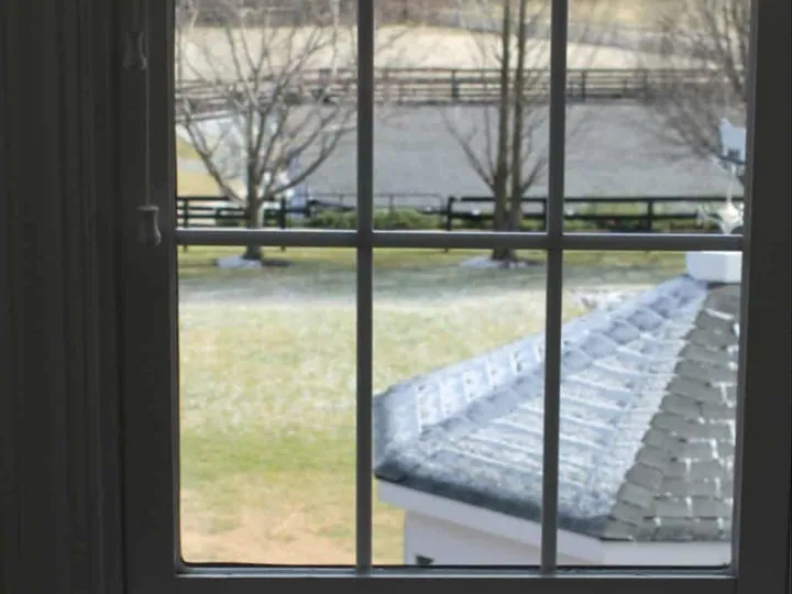 Wood-framed window with divided panes.
