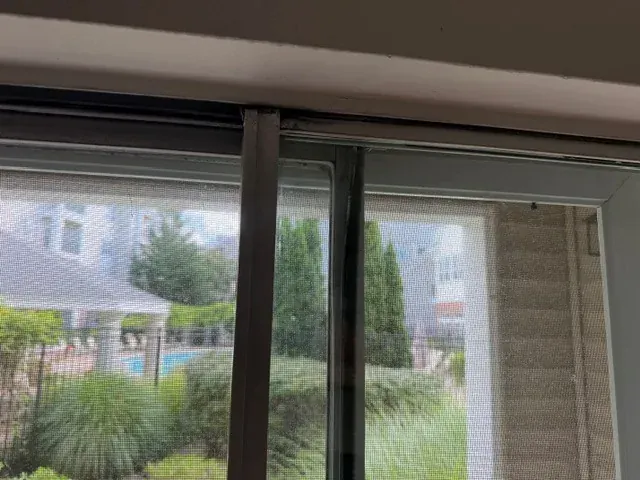 A close-up shows the patio door upper track.