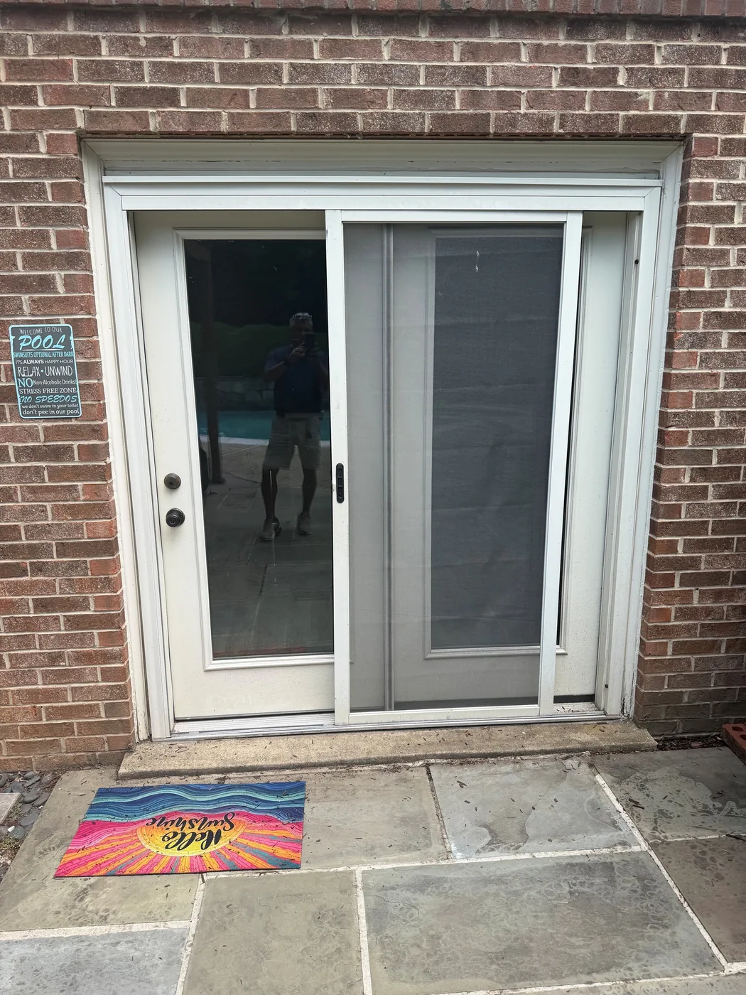 A rear entry has a sliding screen door.