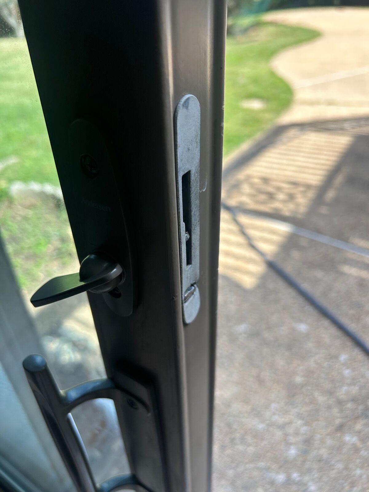 Close-up of a patio door lever handle and lock
