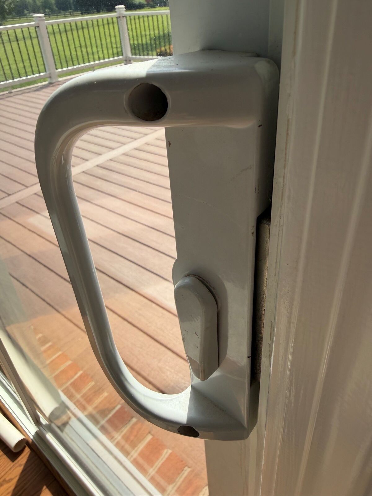 Close-up of a sliding patio door handle and lock
