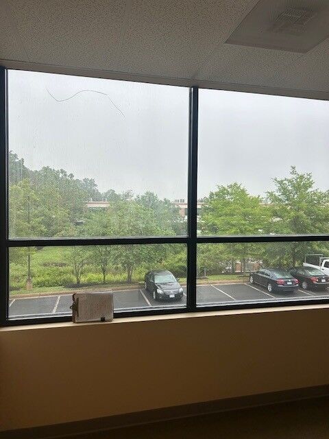 A long crack across the upper pane of a window