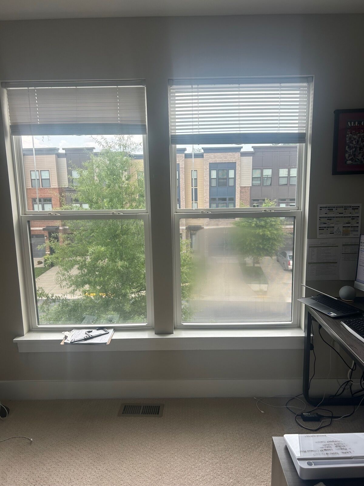 Two windows with a cloudy lower-right pane beside clear glass